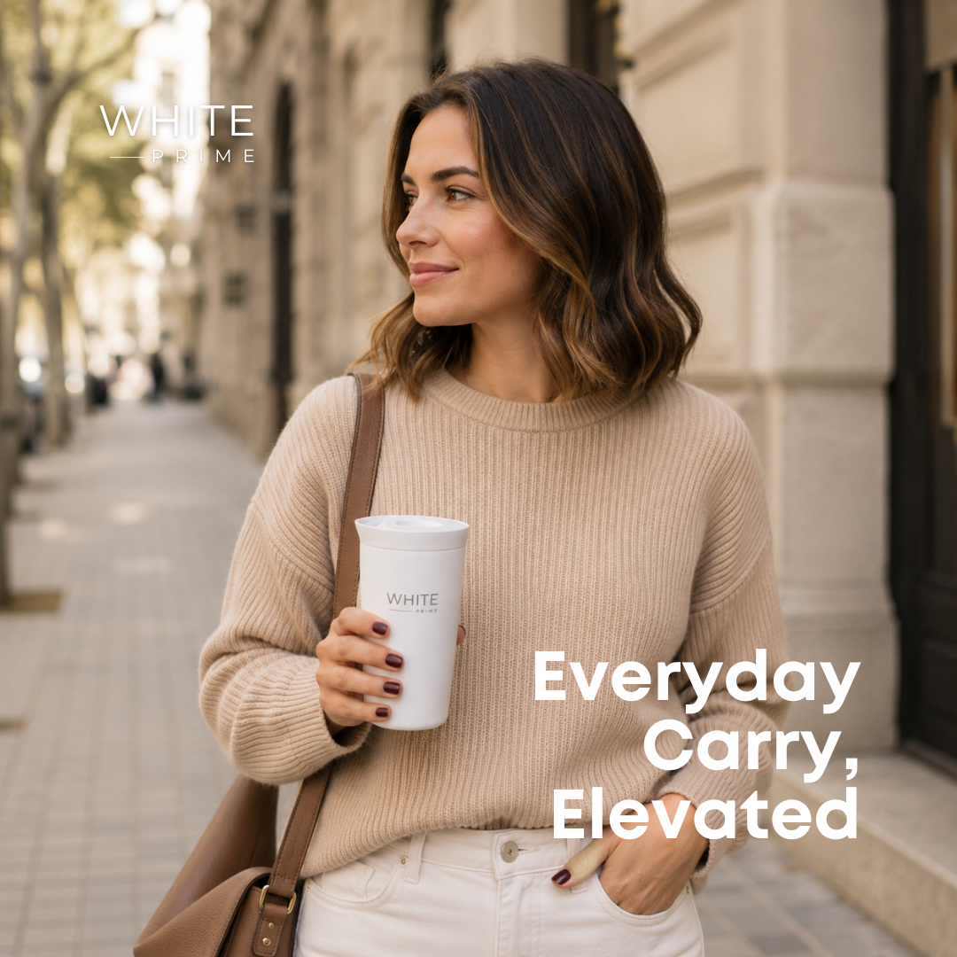 Woman carrying the WHITE Prime insulated coffee mug outdoors