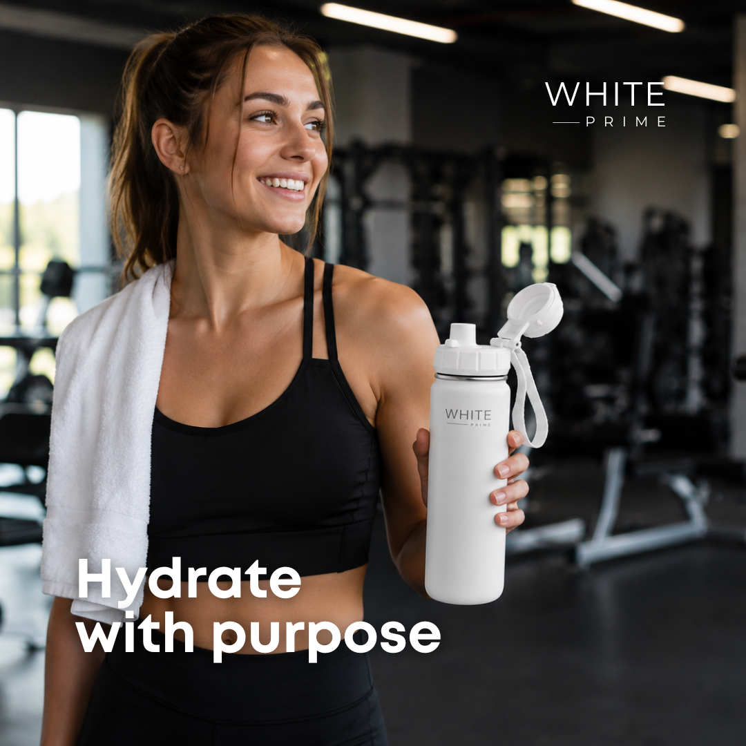 Woman using the WHITE Prime stainless steel water bottle at the gym