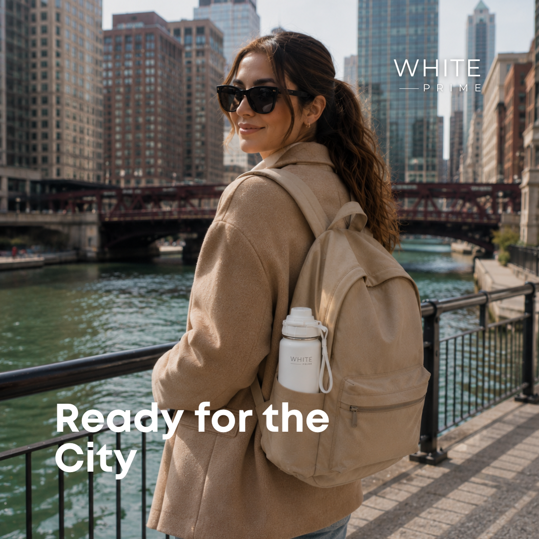 Woman carrying the WHITE Prime insulated water bottle in the city