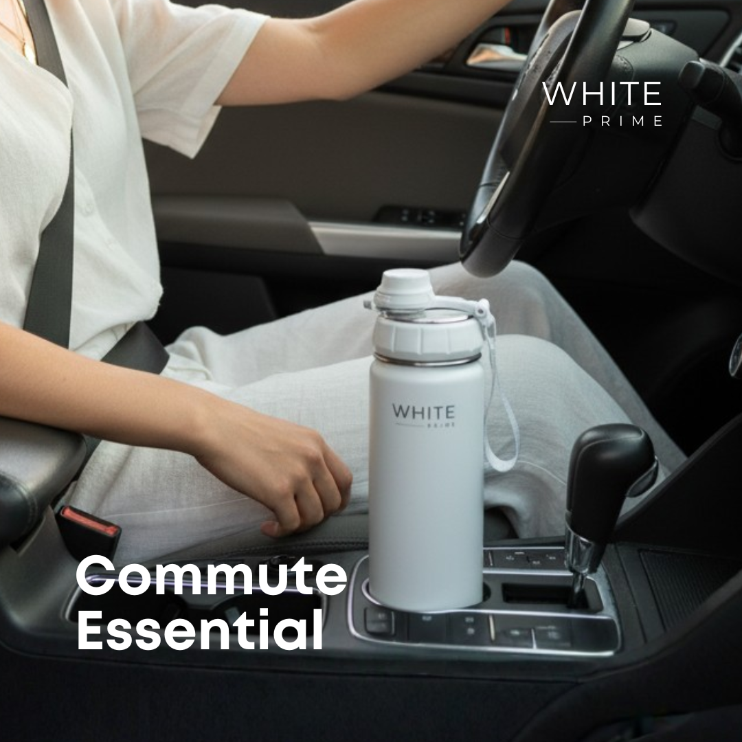 WHITE Prime insulated water bottle inside a commuter bag